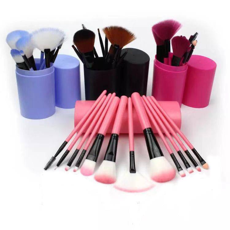 Makeup Brush Set with pink handles, soft synthetic bristles, and colorful cylindrical storage holders