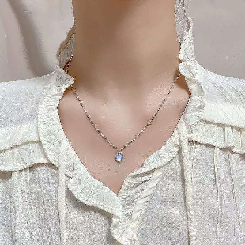 Japan-Korea Style Loving-Heart copper pendant necklace with a silver chain and iridescent blue heart charm