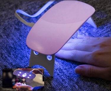 Light Therapy Machine with pink adjustable lamp, black control panel and blue UV LEDs for nail curing