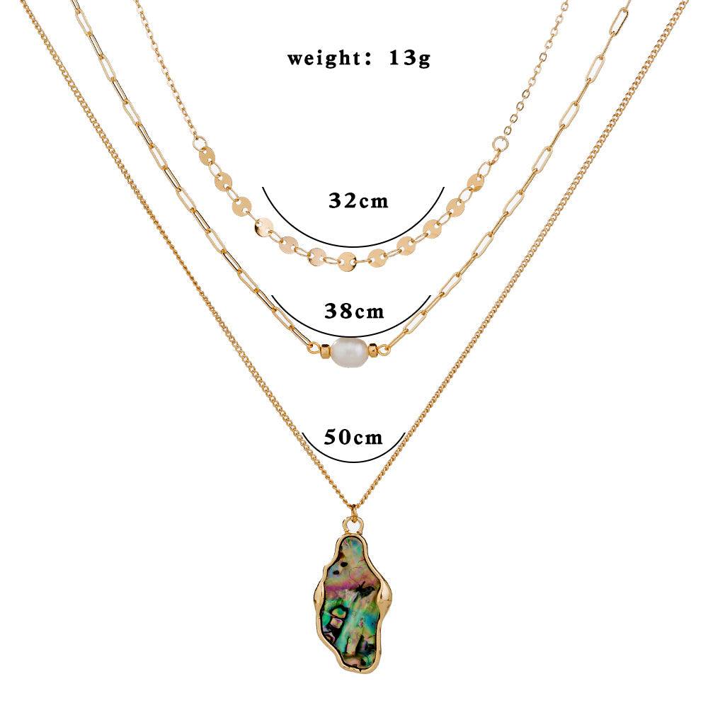 Fashion Personality layered gold-tone necklace with natural pearl, abalone shell pendant, and delicate chain details