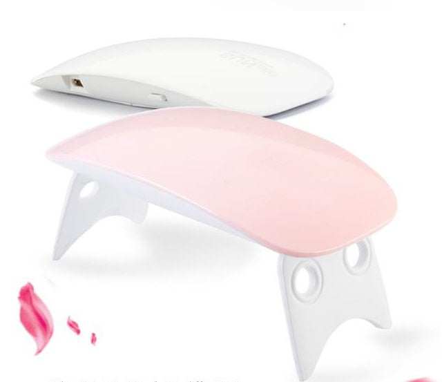 Light Therapy Machine with a pink and white ABS body, compact folding design, and adjustable stand legs