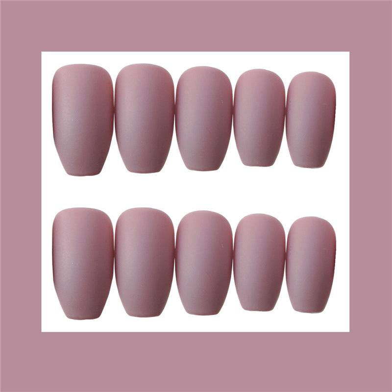 Wearable false nails in a muted mauve pink, matte finish, with rounded tapered tips in assorted sizes
