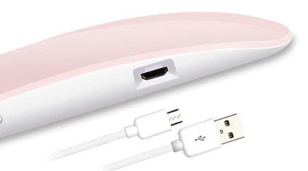 Light Therapy Machine with slim pink and white ABS casing, USB port and included white charging cable