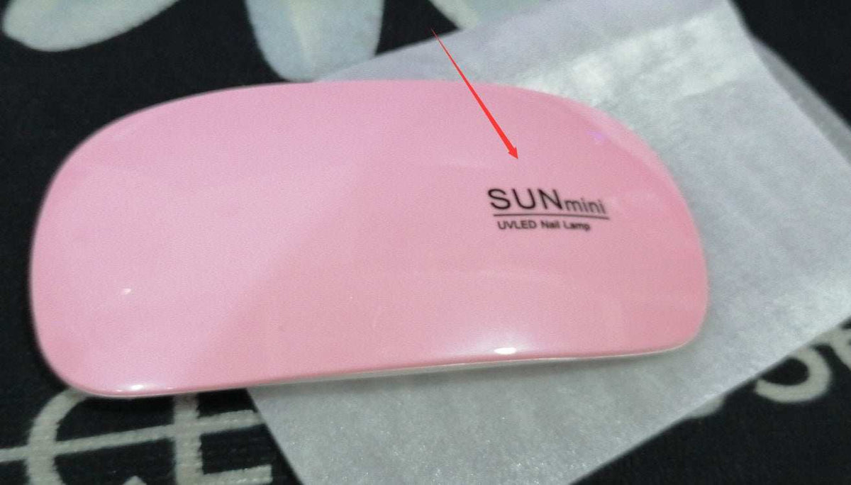 Light Therapy Machine in pink ABS plastic with a compact rounded body and SUNmini UVLED nail lamp label