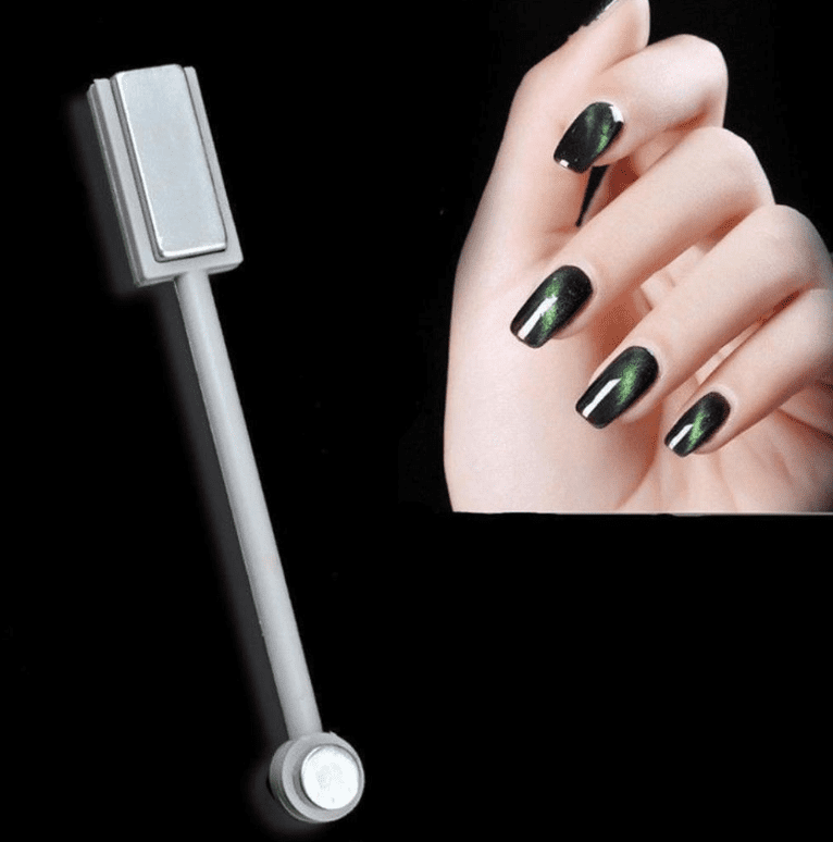 Magnetic Nail Polish with glossy black holographic chameleon finish shown on long manicured nails with magnetic tool