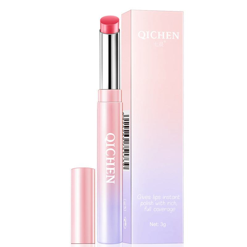 Waterproof lipstick in a pink and lavender metallic tube, with a bright coral-red bullet and matching gradient box