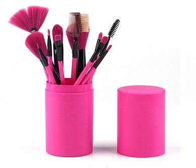 Makeup Brush Set with 12 pink plastic-handled brushes, assorted rayon bristles, and a matching cylindrical storage case