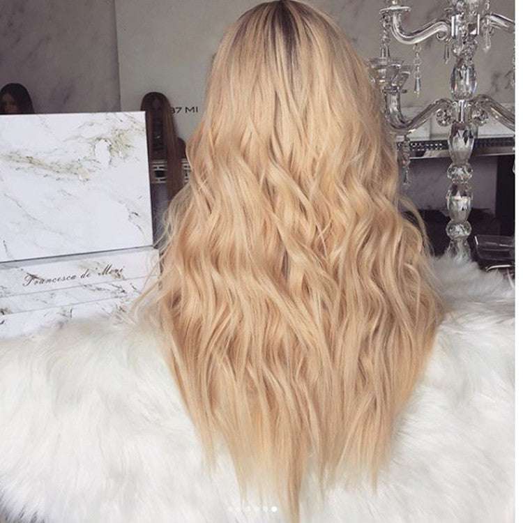 American Style Mid-length Curly Wig in long blonde synthetic fiber with soft, loose waves and darker roots