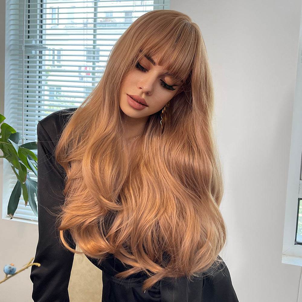 Brown Curly Wig with long, voluminous caramel-brown waves and full straight bangs, made from synthetic fiber