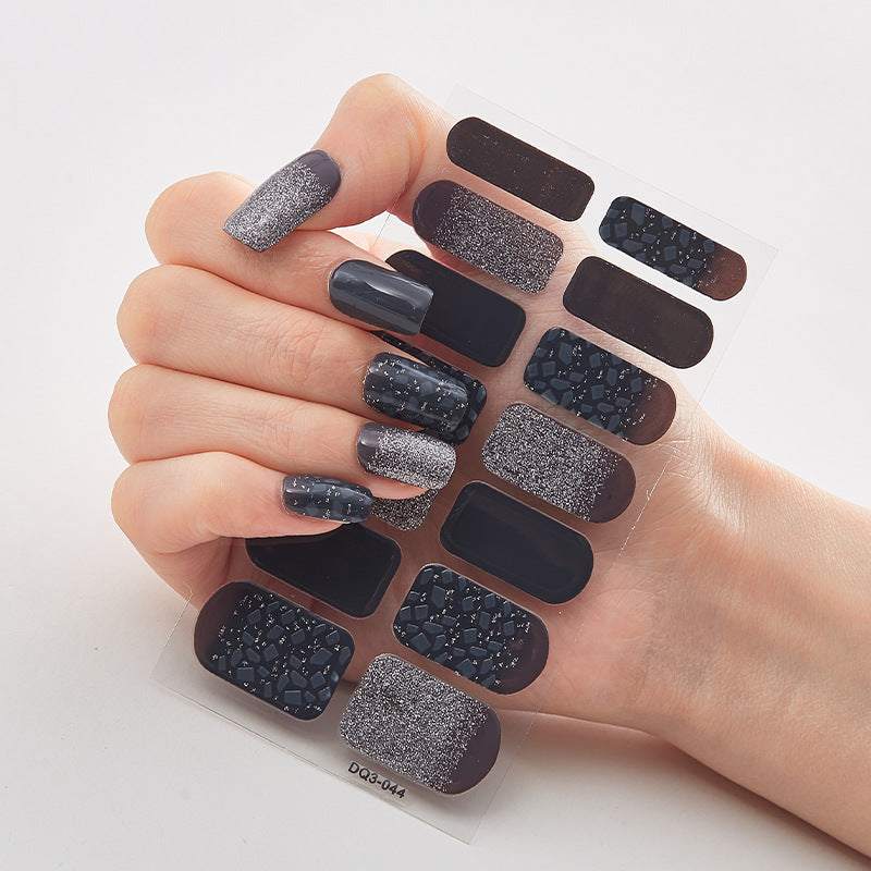 Butterfly Laser Nail Stickers in assorted dark shades, with glitter, metallic finishes and patterned designs on a clear sheet