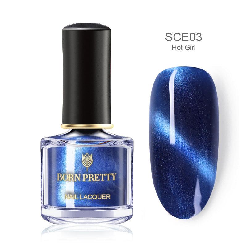 Magnetic Nail Polish in a clear square bottle, featuring deep blue metallic shimmer and a bold cat-eye stripe effect