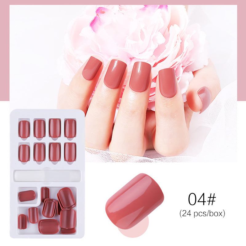 Reusable Stick-On-Nails in glossy muted red acrylic, with rounded square tips and 24 assorted sizes for a salon-style manicure