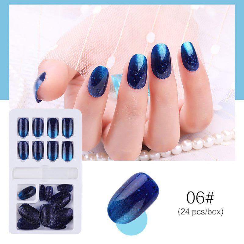 Reusable Stick-On-Nails in glossy navy blue acrylic with sparkling glitter, rounded shape and 24-piece set