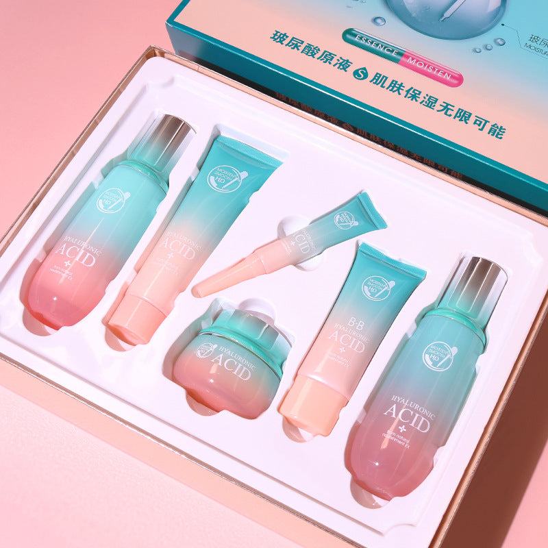 Ultimate Hydration Facial Care Set with turquoise and pink skincare bottles and tubes, featuring hyaluronic acid formulas