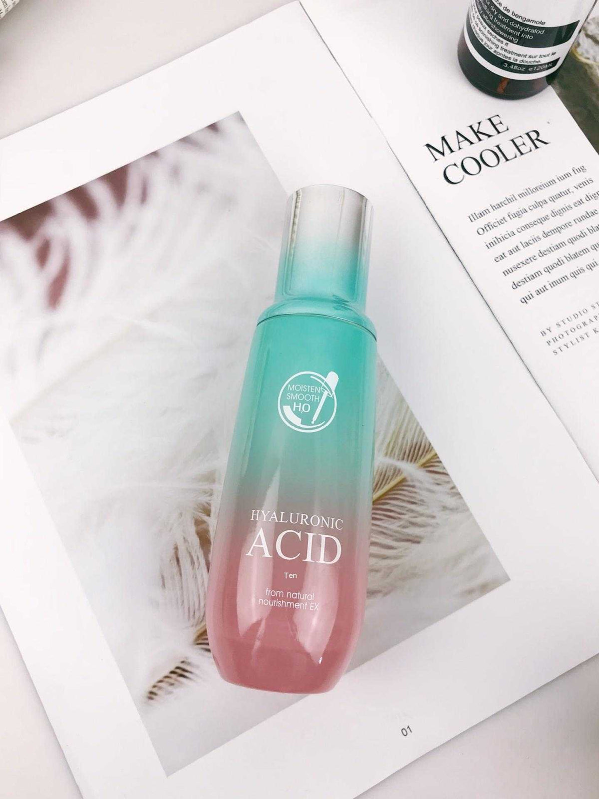 Ultimate Hydration Facial Care Set hyaluronic acid serum in a turquoise-to-pink gradient bottle with clear cap
