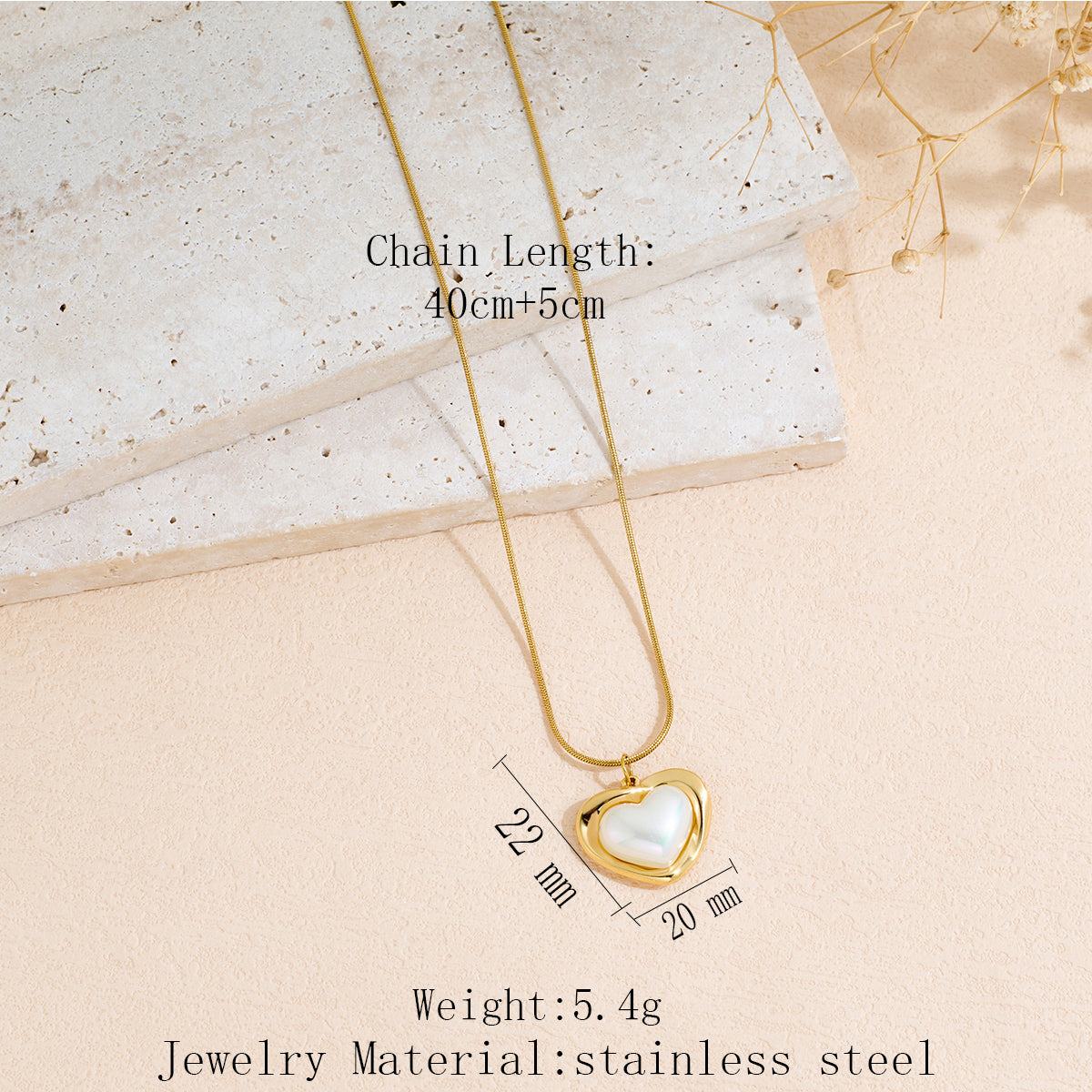 Stainless Steel heart-shaped pendant necklace with a polished gold-tone finish and delicate chain
