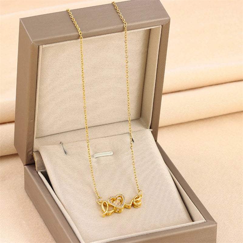 Necklace, a gold-tone titanium steel Valentines Day Gift with a heart pendant and delicate chain.