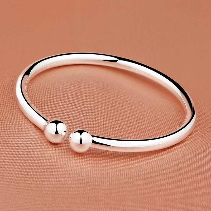 Open bangle in polished rose-gold-tone copper, Garlic-head Plain Surface design with twin spherical ends