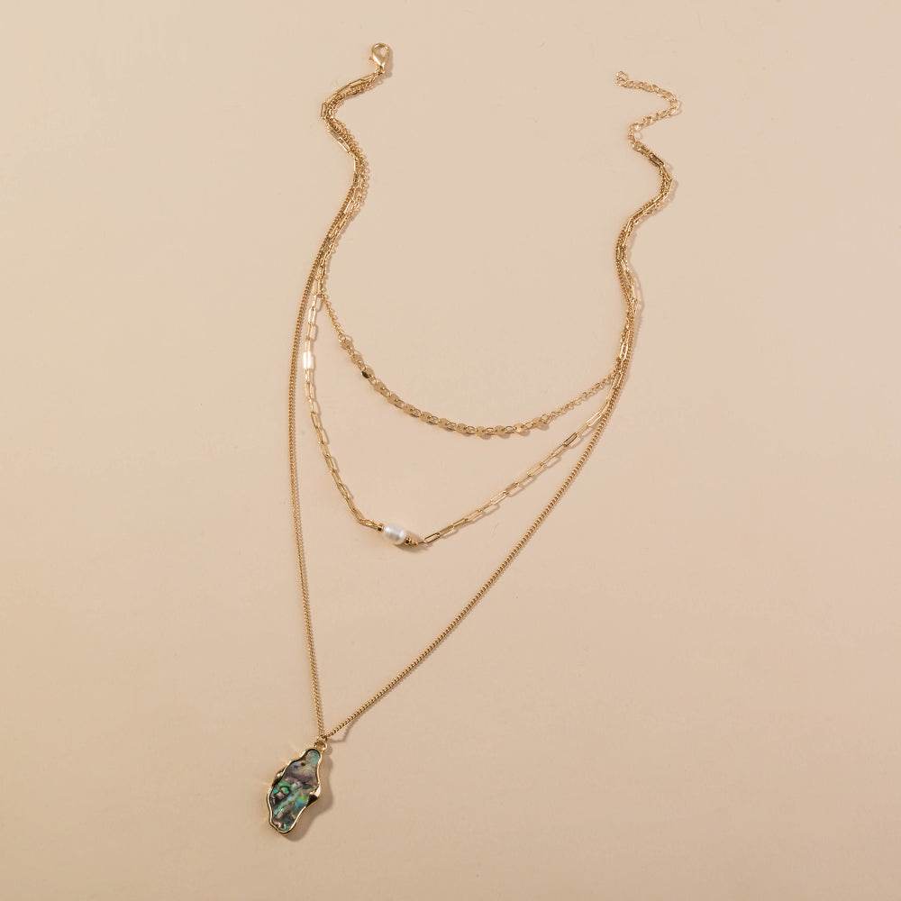 Fashion Personality layered gold-tone necklace with delicate chains, pearl accents and a green abalone shell pendant