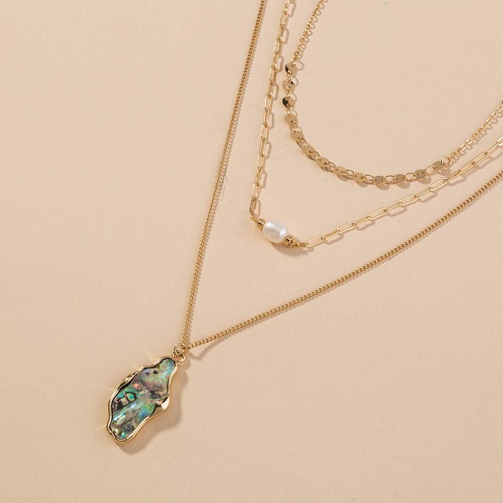 Fashion Personality layered gold-tone necklace with iridescent abalone shell pendant and pearl accent, mixed chain styles