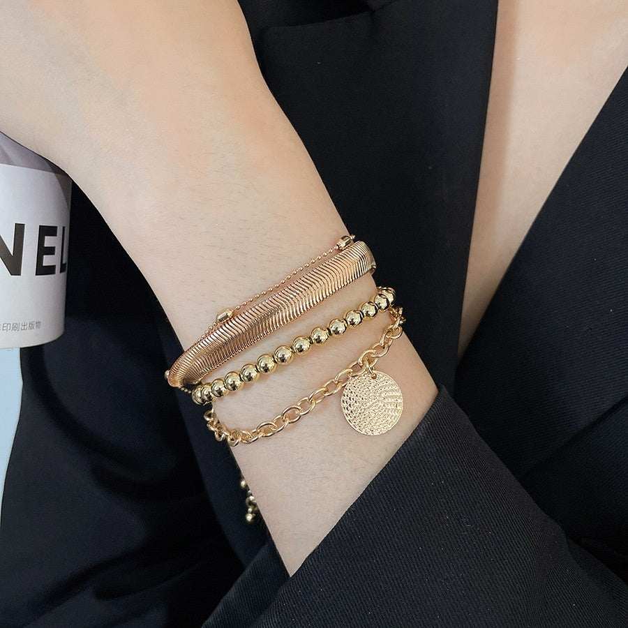 All-Match Round Pendant bracelet set of four in gold-tone metal, featuring layered chains, beads and textured discs
