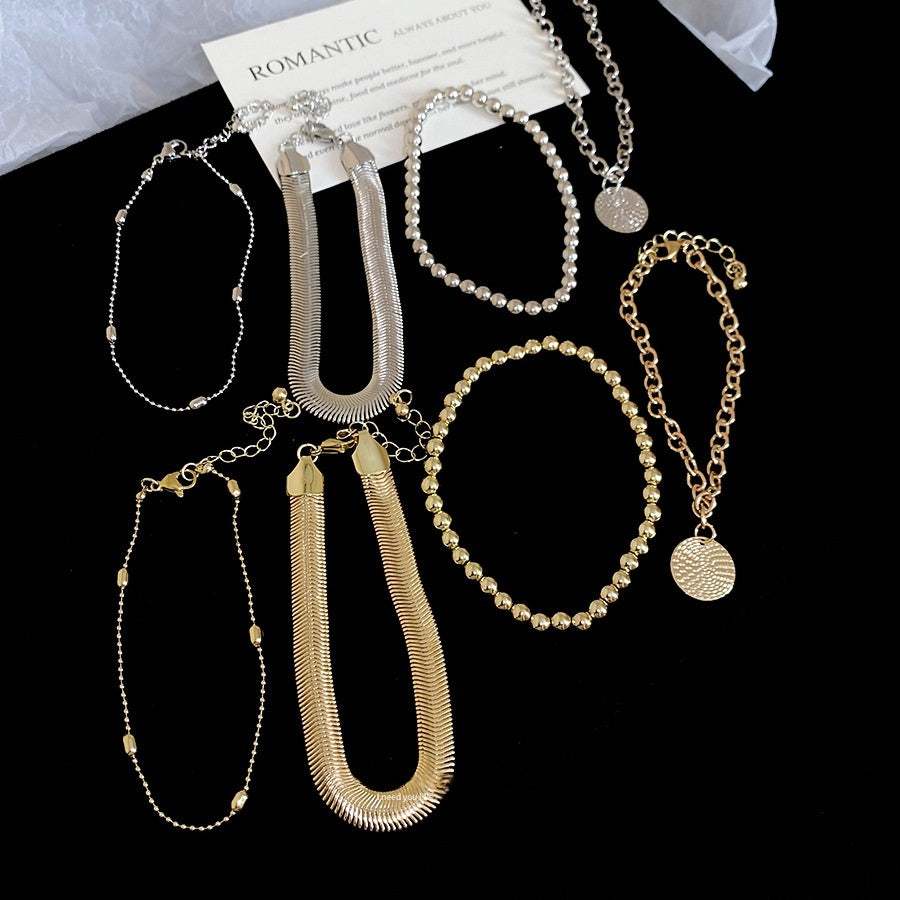 All-Match Round Pendant bracelet set, four gold and silver iron pieces with textured chains and circular pendants