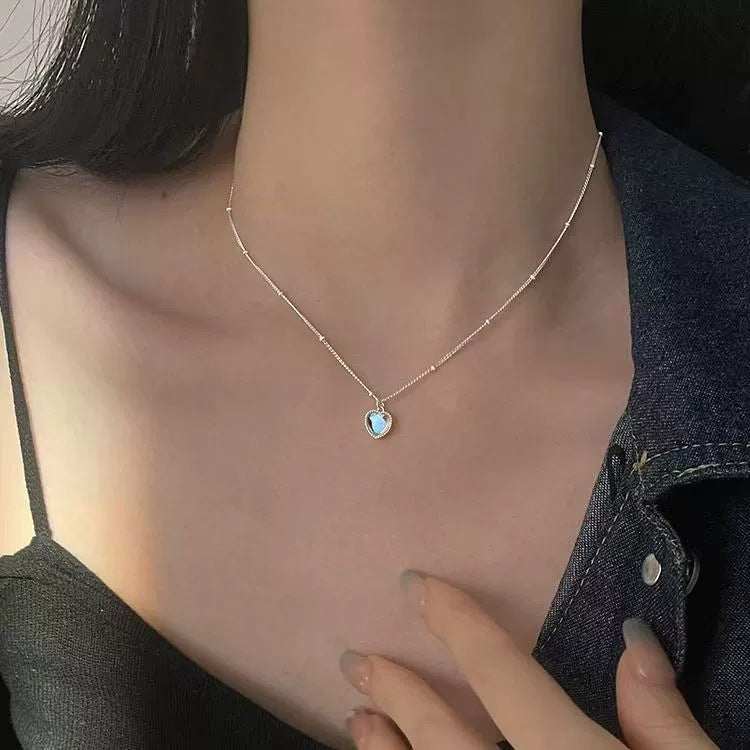 Japan-Korea Style Loving-Heart pendant necklace in silver-tone copper, featuring a small blue heart charm on a fine chain