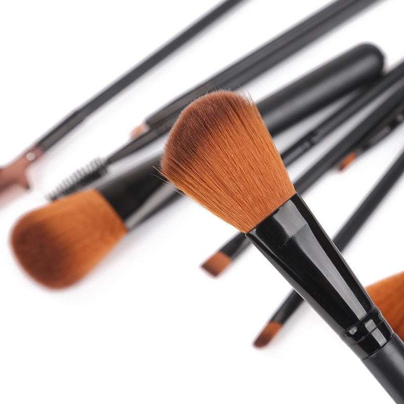 Makeup Brush Set with soft brown synthetic bristles and glossy black plastic handles in varied shapes